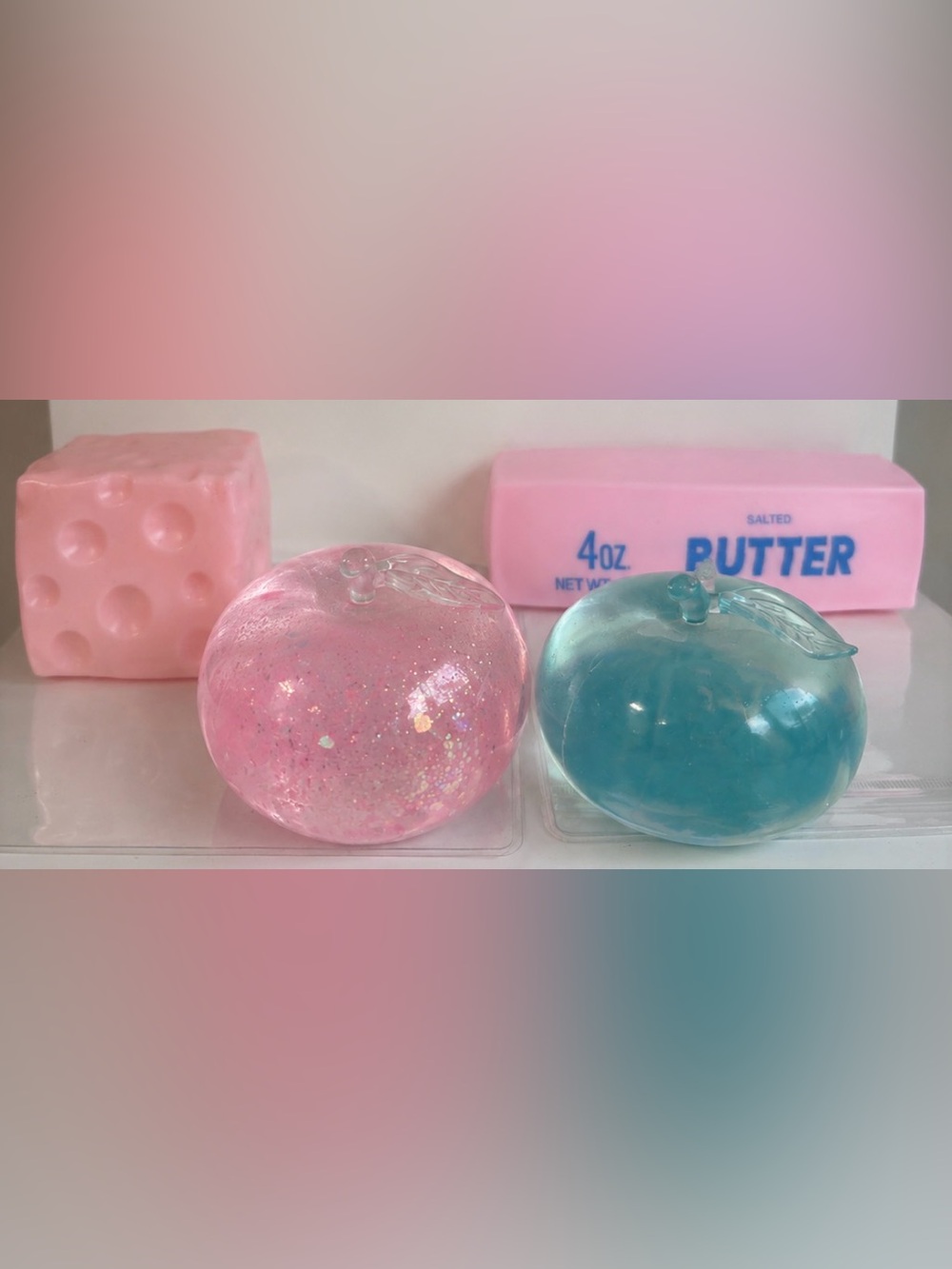 Crunchy butter, PinkMoldableCheese, 2 apple squish. All new, sealed. Squeezeluck